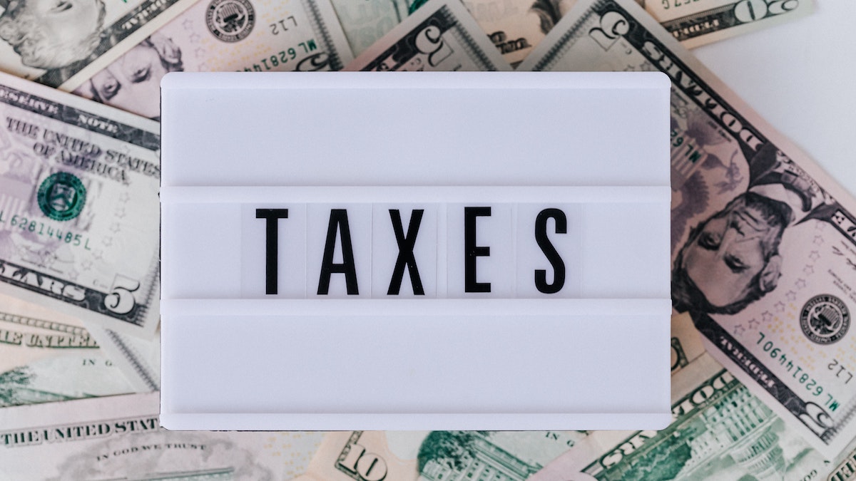 An image of the word taxes. It's important to know how a tax lien tax deed are created.