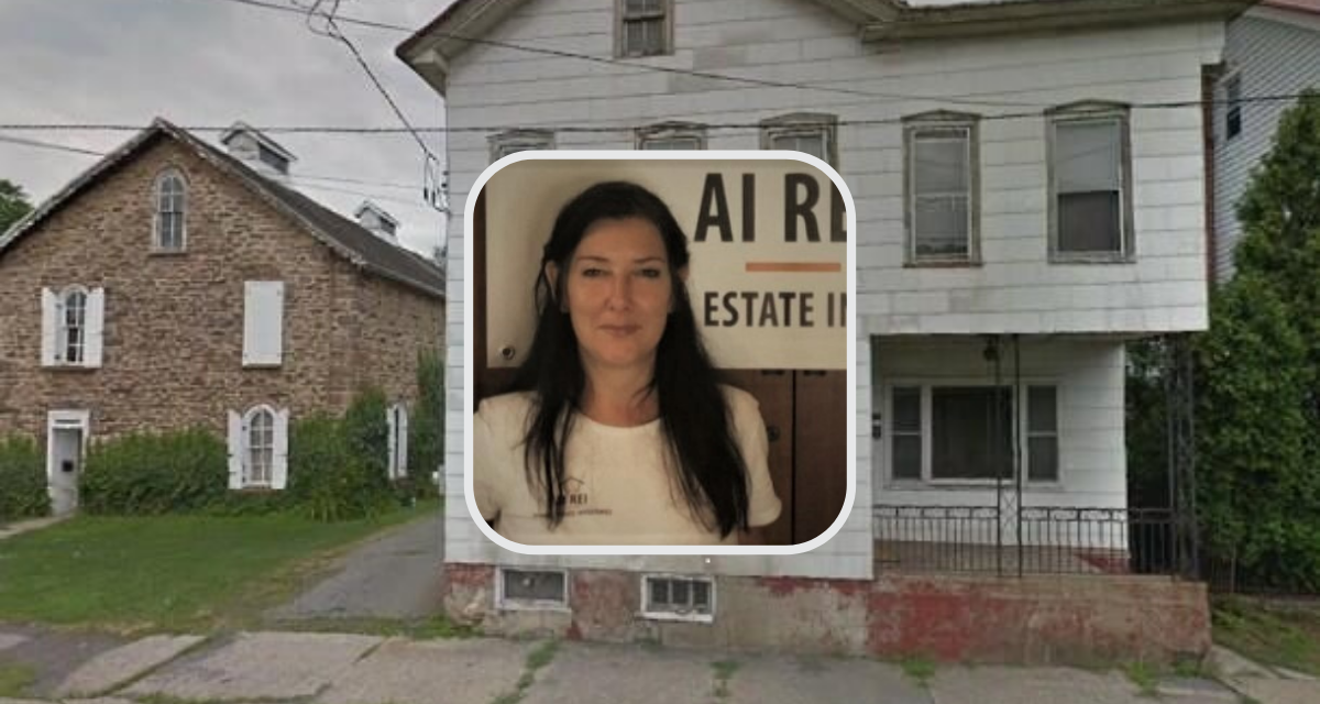 Woman in front of old house