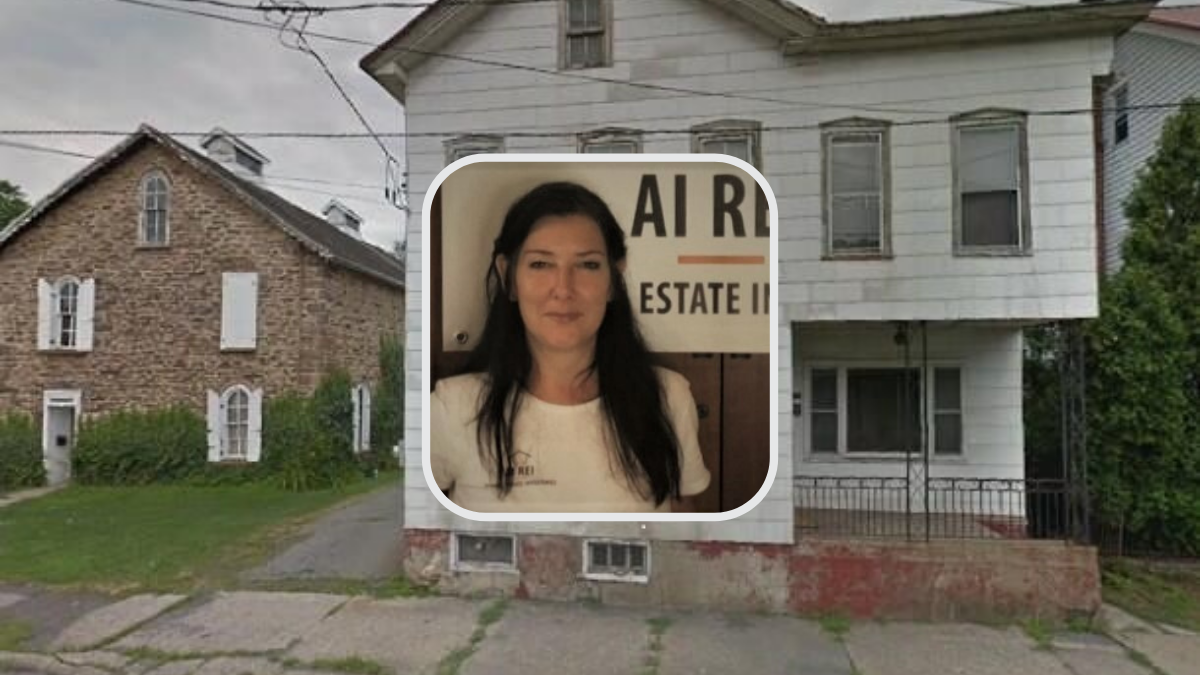 Woman in front of old house